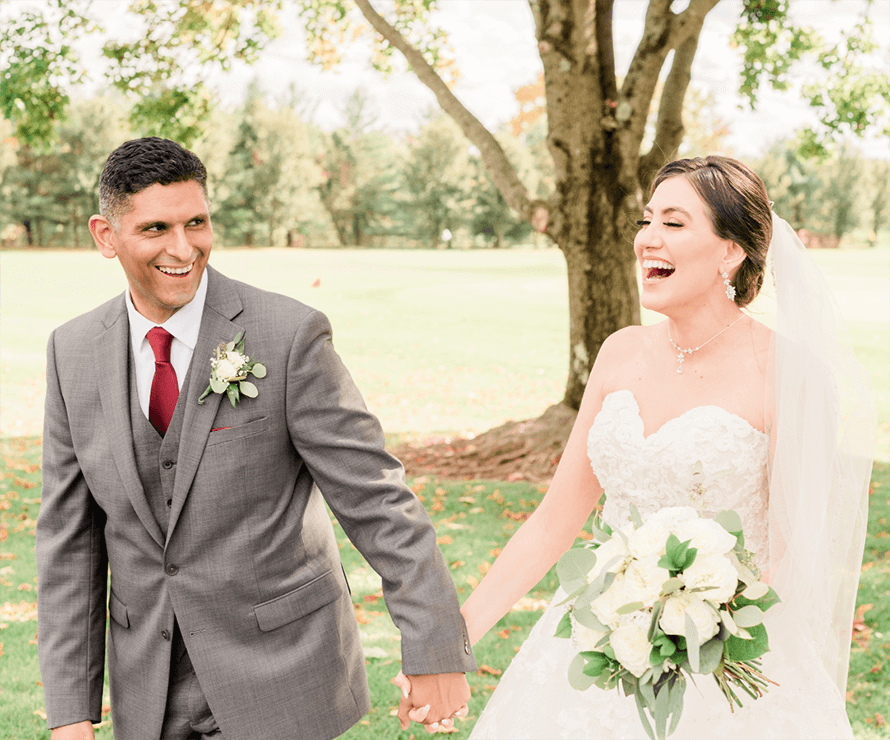 bride and groom walking outside